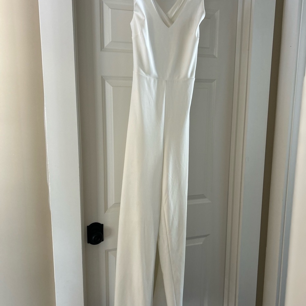 Elegant Cream Halter Jumpsuit with Cross Back.